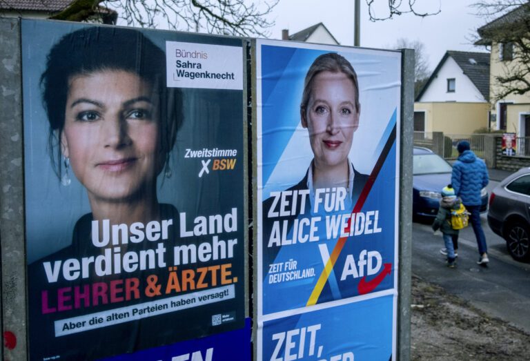 Election posters of top candidate of AfD Alice Weidel, right, and Sara Wagenknecht of the BSW are pictured in Wehrheim near Frankfurt, Germany, Thursday, Feb. 13, 2025. (AP Photo/Michael Probst)