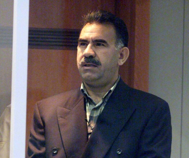 epa07551239 (FILE) - Abdullah Ocalan, leader of the Kurdistan Workers Party PKK, stands inside a bullet-proof case and listens to his verdict during his trial at the military prison at Imrali island off Turkish coast, 29 June 1999 (reissued 06 May 2019). According to reports, Ocalan has been allowed to see his lawyers for the first time since 2011.  EPA/ANATOLIA NEWS AGENCY *** Local Caption *** 00432068