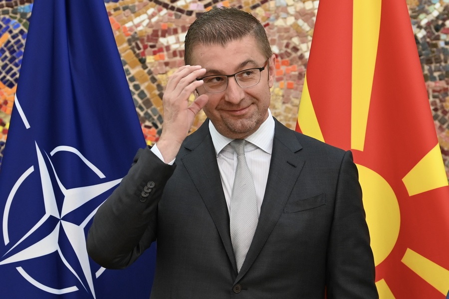 epaselect epa11393062 North Macedonia's Prime Minister-elect and VMRO-DPMNE party leader Hristijan Mickoski reacts after receiving the mandate to form a new government, in Skopje, Republic of North Macedonia, 06 June 2024. The right-wing VMRO-DPMNE party won the parliamentary elections held on 08 May 2024. Its leader Hristijan Mickoski has a deadline of 20 days to form a new government after receiving the mandate.  EPA/GEORGI LICOVSKI