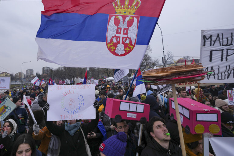 People shout slogans during a student-led large protest and a 15-hour blockade of the streets in Serbian industrial town of Kragujevac, to protest the deaths of 15 people killed in the November collapse of a train station canopy, Saturday, Feb. 15, 2025. (AP Photo/Darko Vojinovic)