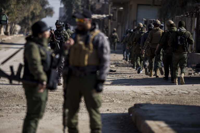 US backed Syrian Democratic Forces soldiers search for Islamic State militants in Hassakeh, Syria, Friday, Jan. 28, 2022. Friday's search came as U.S.-backed fighters set a deadline for dozens of armed extremists who remained holed up in a small part of the jail to surrender or face an all-out attack. (AP Photo/Baderkhan Ahmad)